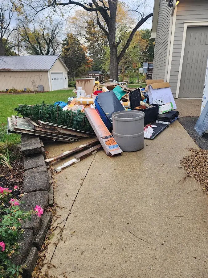 Dumpster being loaded with debris for Demolition Dumpster Rental in Williamsport